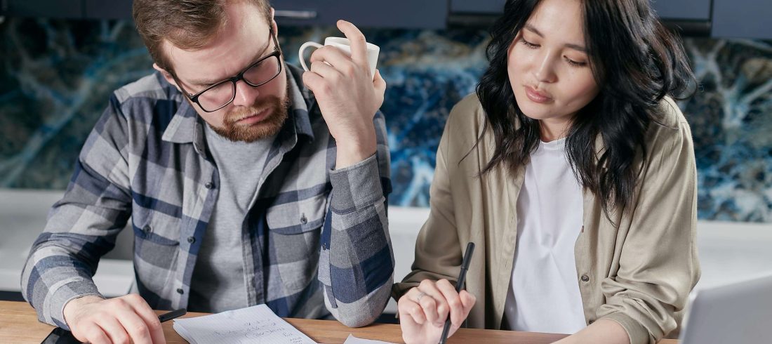 debt-settlement-negotiation-louisiana Louisiana resident reviewing debt settlement agreement paperwork while negotiating resolution of debt lawsuit