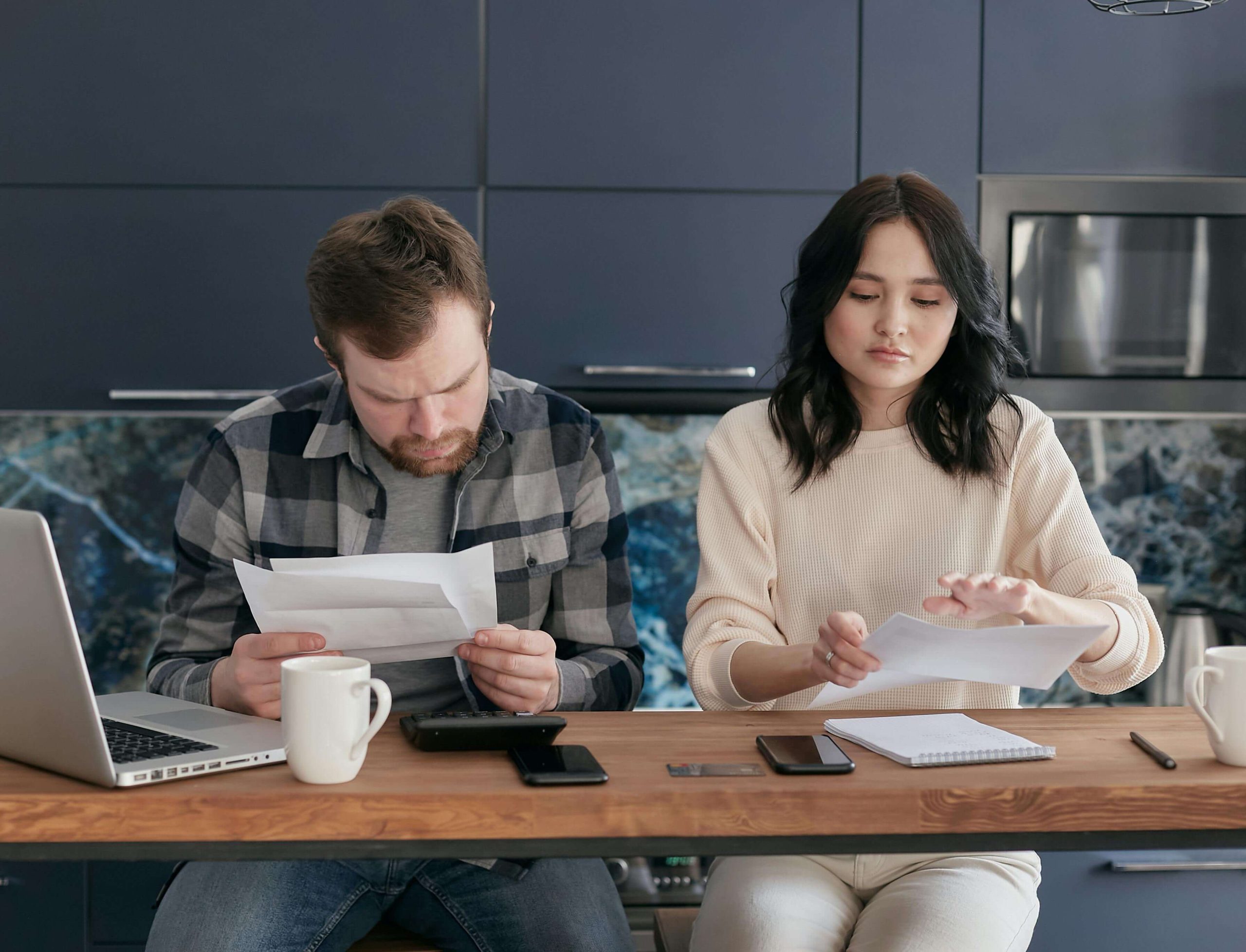 Person reviewing reduced paycheck due to Louisiana wage garnishment order